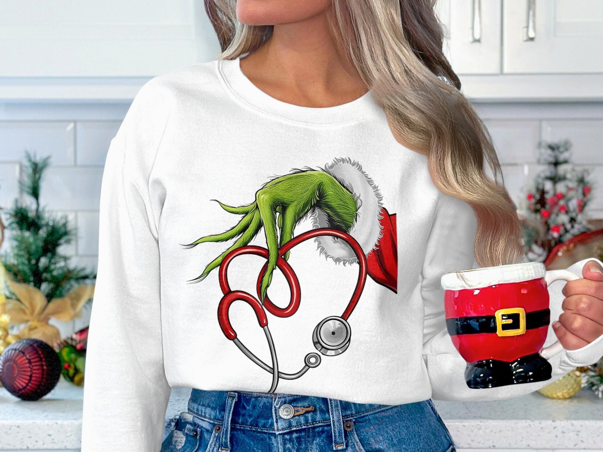 Grinch Hand Holding Stethoscope Sweatshirt, Christmas Nurse Gift, Funny Holiday Nurse Shirt, Unique Christmas Sweater for Nurses