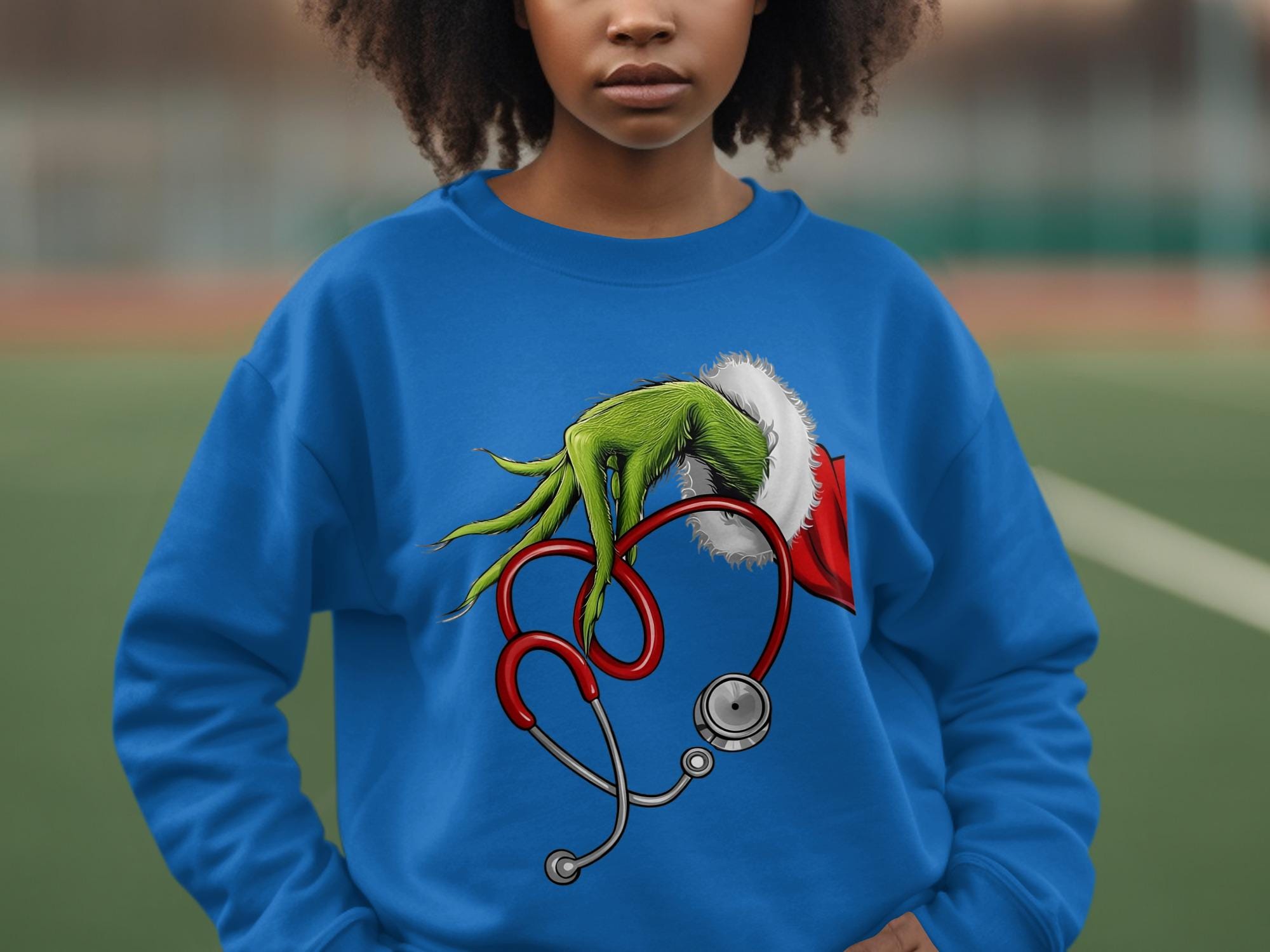 Grinch hand holding stethoscope Christmas sweatshirt, funny holiday sweatshirt for nurses and doctors, cozy festive sweater